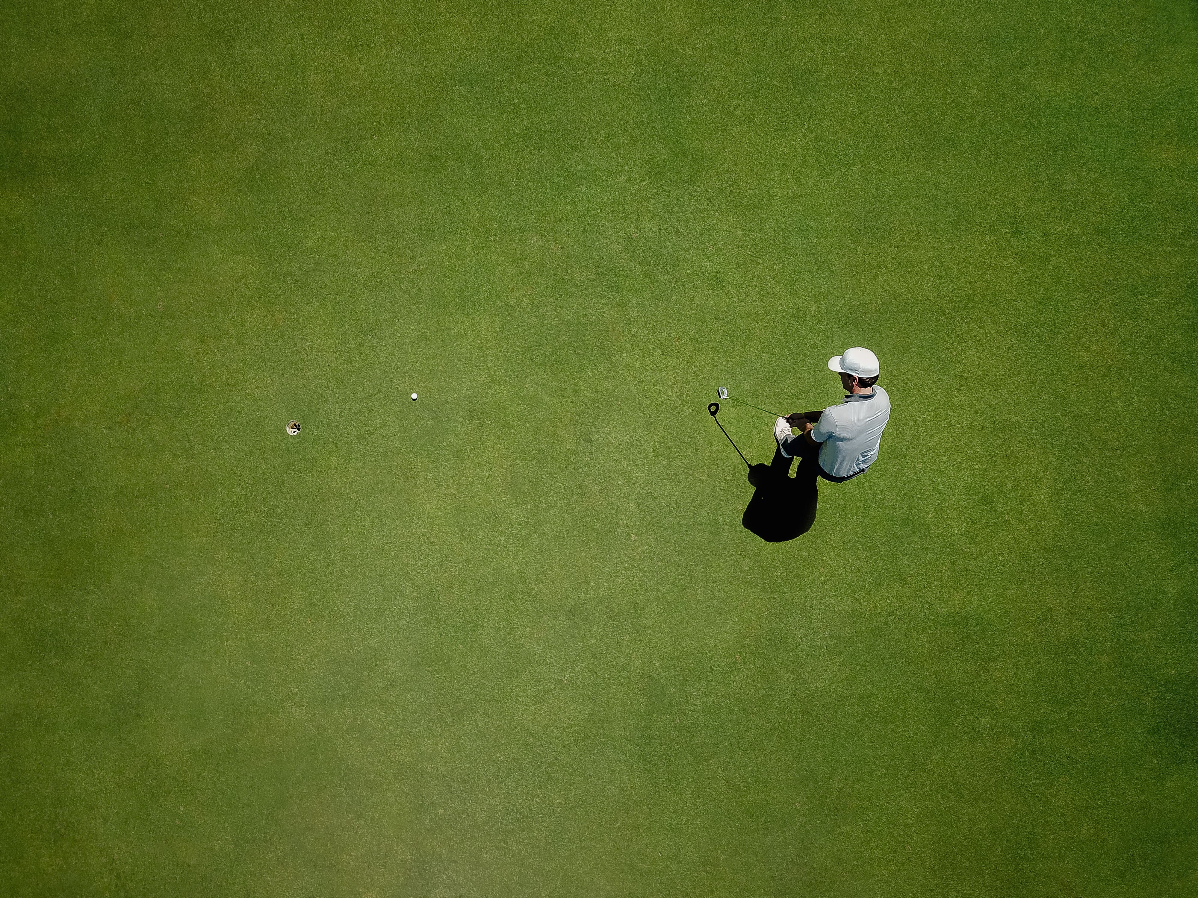 overhead-shot-of-golfer-on-green-course-2026-03-25-02-45-51-utc